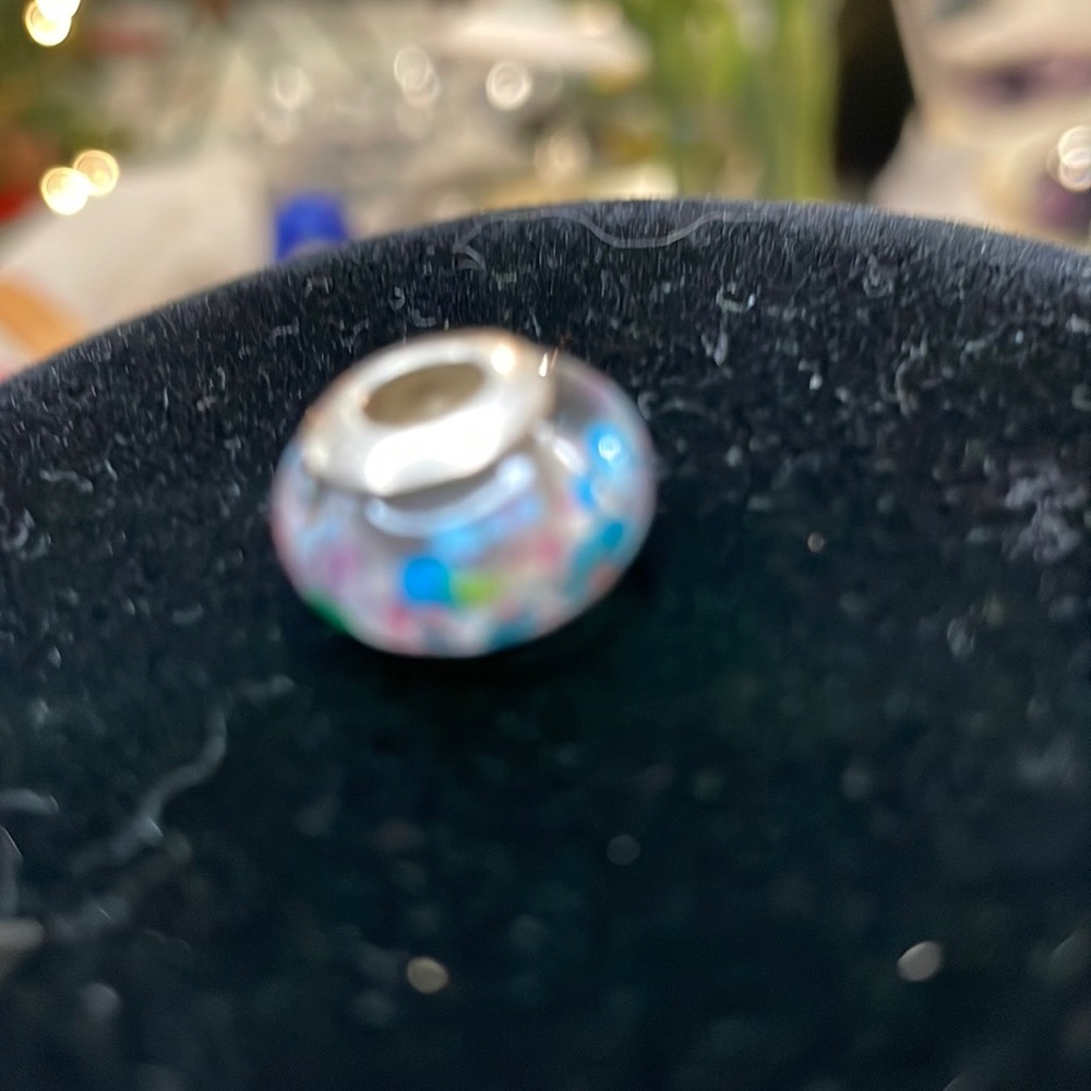 Pandora charm new without box has blues and purple dots. Silver
